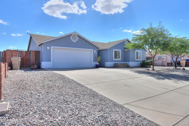 ranch-style home featuring a garage