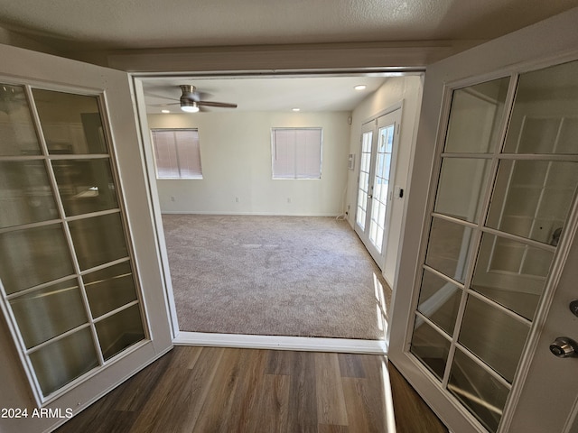 interior space featuring ceiling fan and french doors