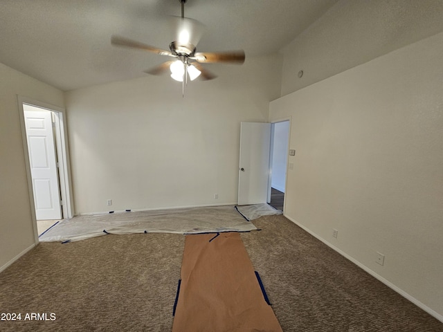 spare room featuring ceiling fan, carpet floors, and high vaulted ceiling