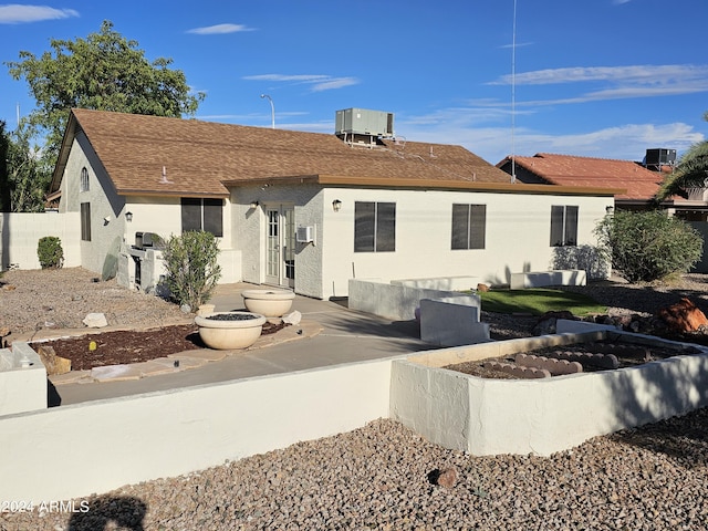 view of front of home featuring cooling unit