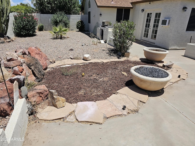 view of yard with french doors and a patio