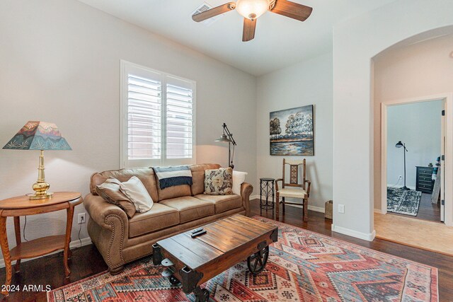 kitchen with light stone counters, pendant lighting, stainless steel appliances, and plenty of natural light