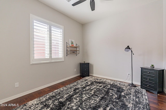 interior space with ceiling fan and dark hardwood / wood-style flooring