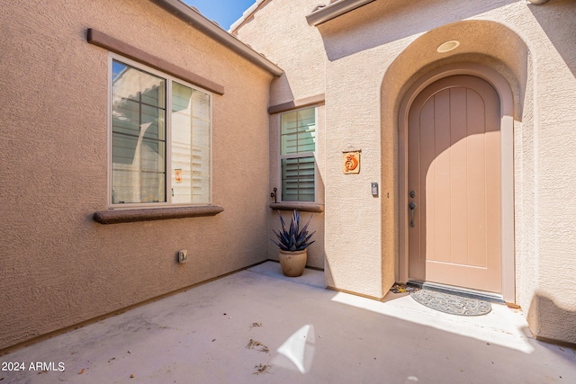 doorway to property featuring a patio