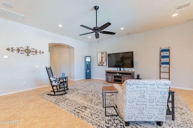 living room featuring ceiling fan and light tile patterned floors