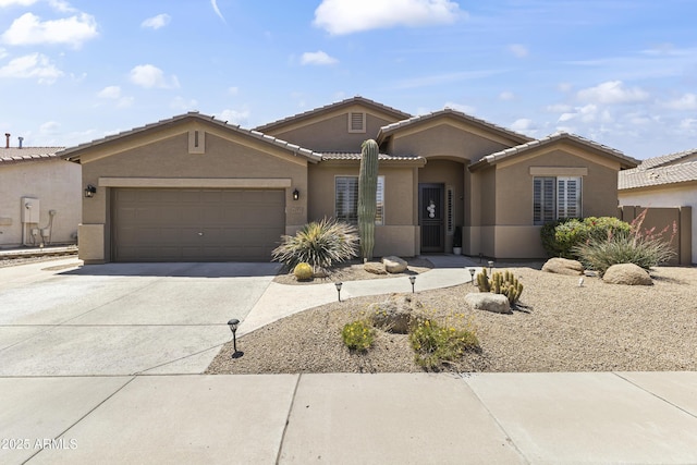 6213 W Gambit Trl, Phoenix, AZ 85083 - view of front of home with stucco siding, concrete driveway, a garage, and a tiled roof