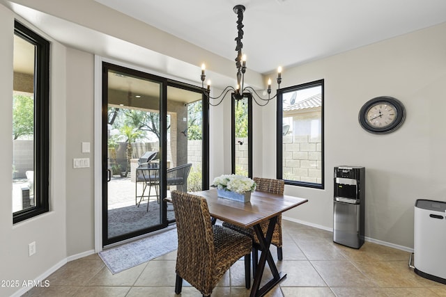 6213 W Gambit Trl, Phoenix, AZ 85083 - dining space with a chandelier, light tile patterned floors, and baseboards