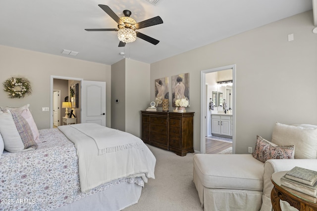 6213 W Gambit Trl, Phoenix, AZ 85083 - bedroom featuring light colored carpet, a ceiling fan, and ensuite bathroom