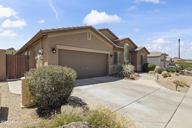 6213 W Gambit Trl, Phoenix, AZ 85083 - view of front of house with concrete driveway, a garage, a tiled roof, and stucco siding