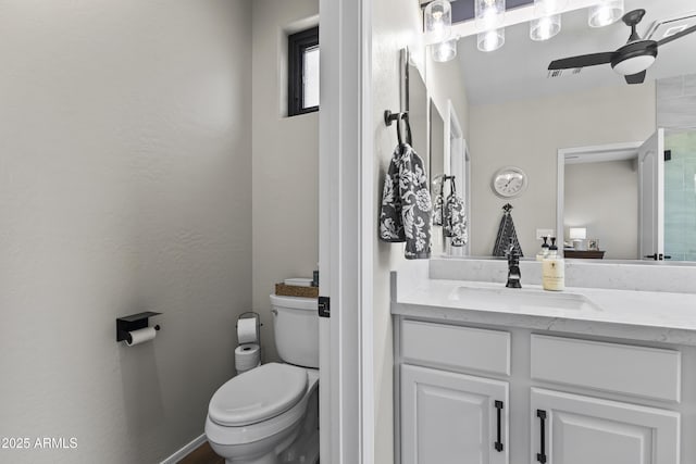 6213 W Gambit Trl, Phoenix, AZ 85083 - bathroom with toilet, vanity, and a ceiling fan