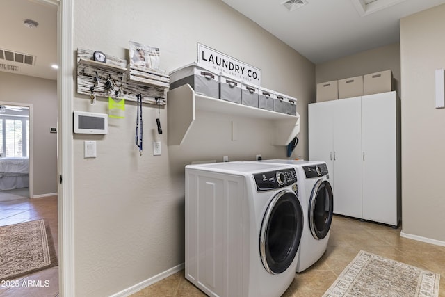 6213 W Gambit Trl, Phoenix, AZ 85083 - washroom featuring separate washer and dryer, light tile patterned floors, and baseboards