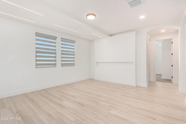 unfurnished room featuring light wood-type flooring