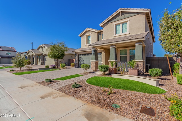 craftsman-style home with a garage and a porch