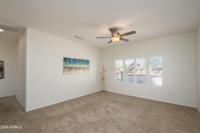 carpeted empty room with ceiling fan