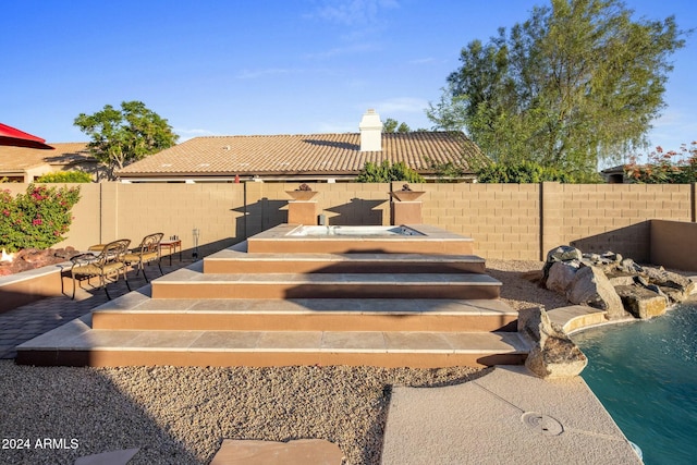 exterior space featuring pool water feature