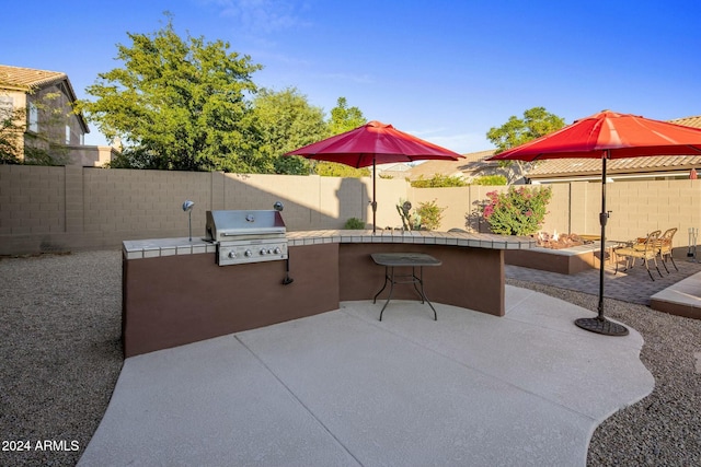 view of patio / terrace with a bar and area for grilling