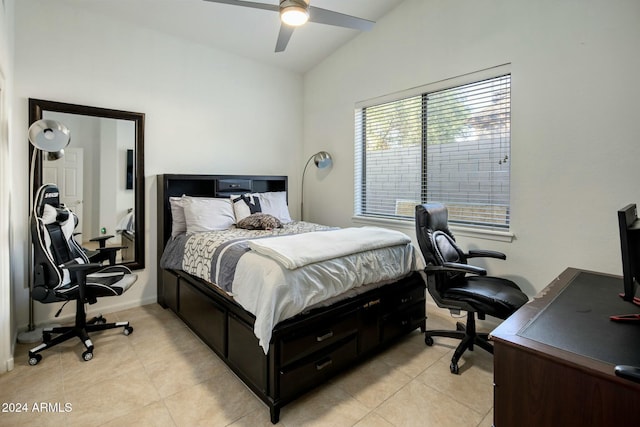 bedroom featuring light tile patterned floors, ceiling fan, and lofted ceiling