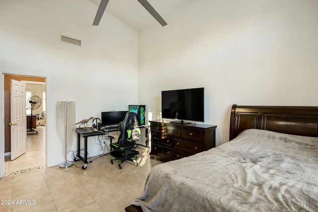 bedroom with ceiling fan, beam ceiling, light tile patterned floors, and high vaulted ceiling