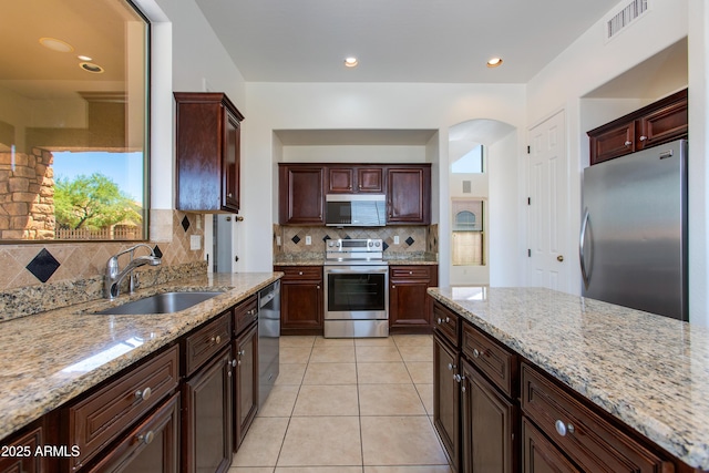 3030 N Saranac, Mesa, AZ 85207 - kitchen featuring appliances with stainless steel finishes, tasteful backsplash, light stone counters, and recessed lighting