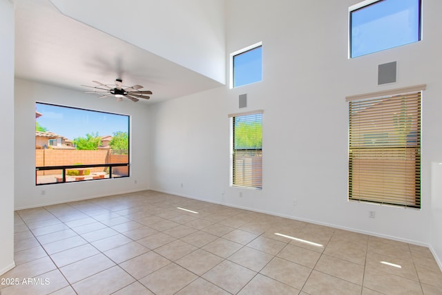 3030 N Saranac, Mesa, AZ 85207 - spare room featuring light tile patterned floors, a high ceiling, and a ceiling fan