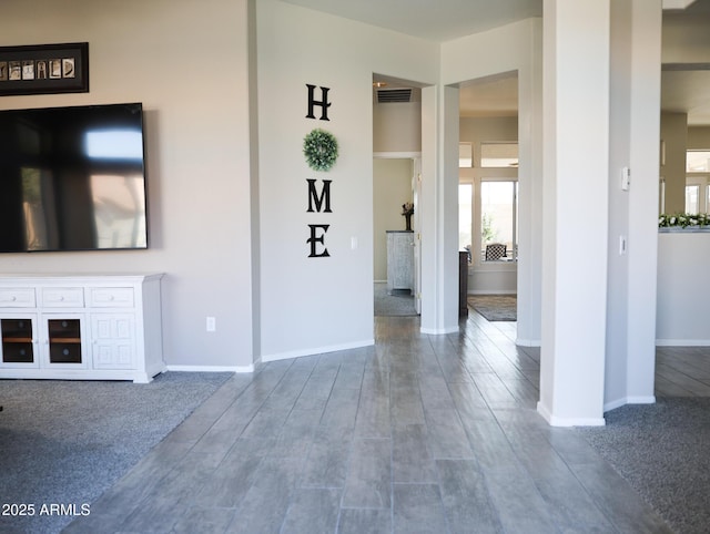 unfurnished living room with wood-type flooring