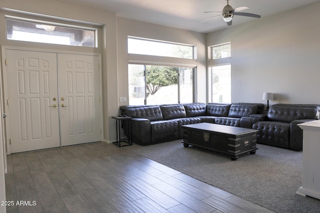 living room with hardwood / wood-style floors, a healthy amount of sunlight, and ceiling fan