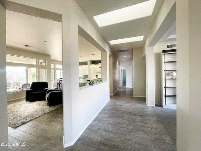 hallway with a skylight