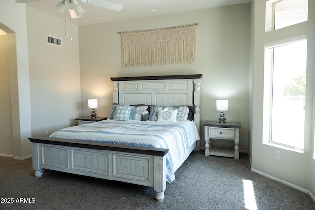 bedroom featuring dark carpet