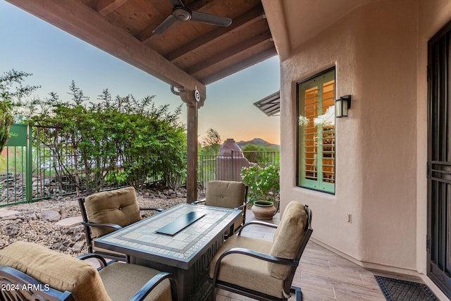 patio terrace at dusk with ceiling fan