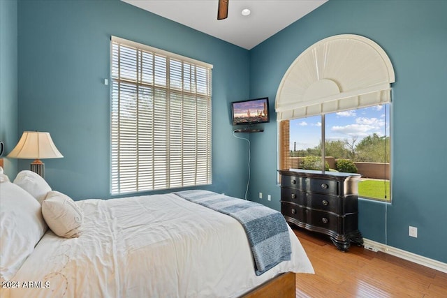 bedroom with ceiling fan and hardwood / wood-style flooring