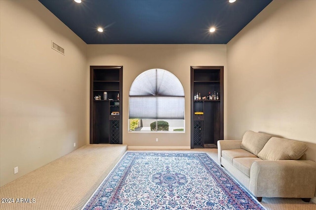 sitting room with carpet floors