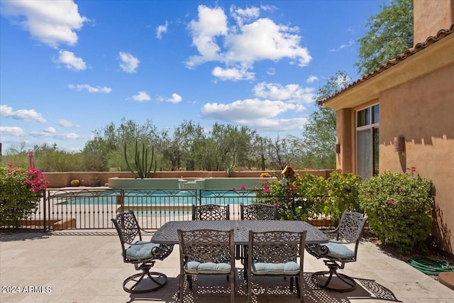 view of patio featuring a fenced in pool