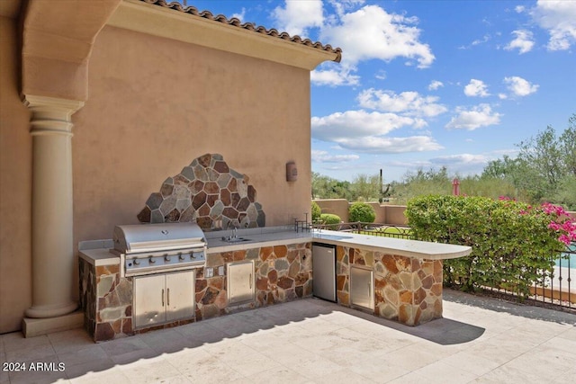 view of patio / terrace with exterior kitchen and area for grilling