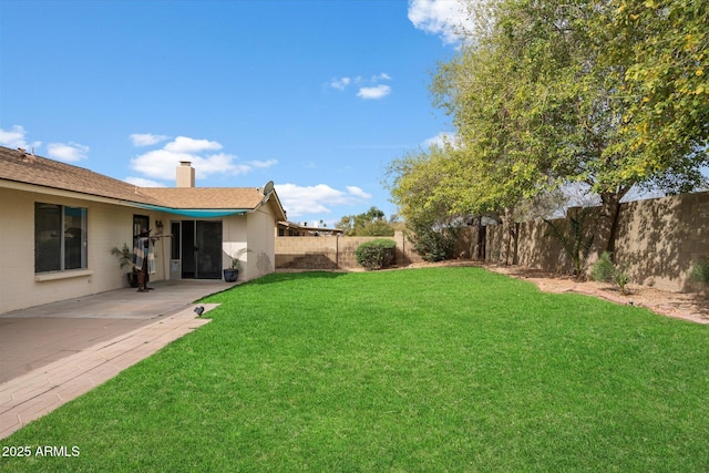 view of yard with a patio and a fenced backyard