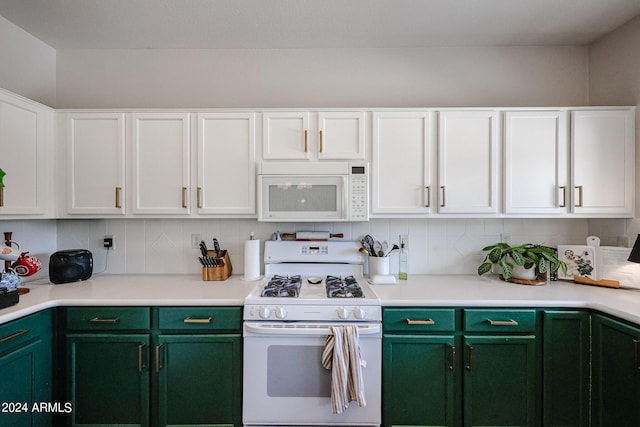 kitchen featuring backsplash, green cabinets, white cabinetry, and white appliances