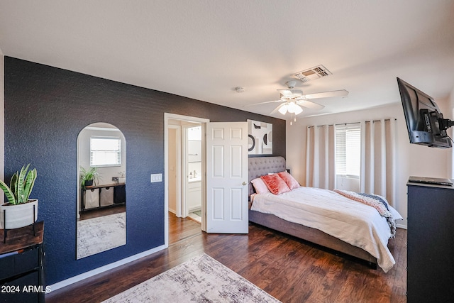 bedroom featuring dark hardwood / wood-style flooring and ceiling fan