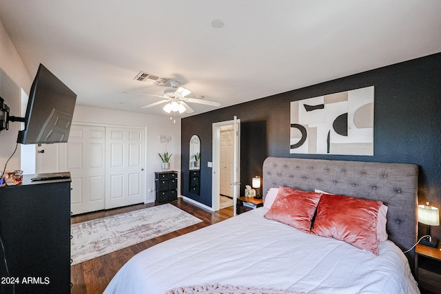 bedroom featuring a closet, ceiling fan, and dark hardwood / wood-style flooring