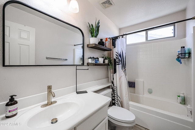 full bathroom featuring oversized vanity, toilet, and shower / tub combo with curtain