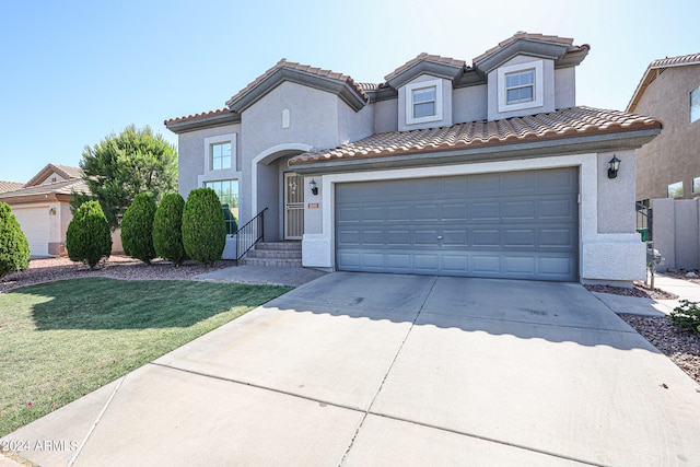 mediterranean / spanish-style home with a front yard