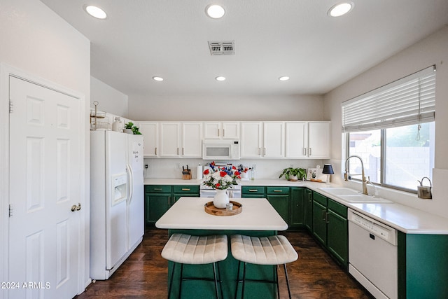 kitchen featuring white appliances, dark wood-type flooring, white cabinetry, and green cabinets