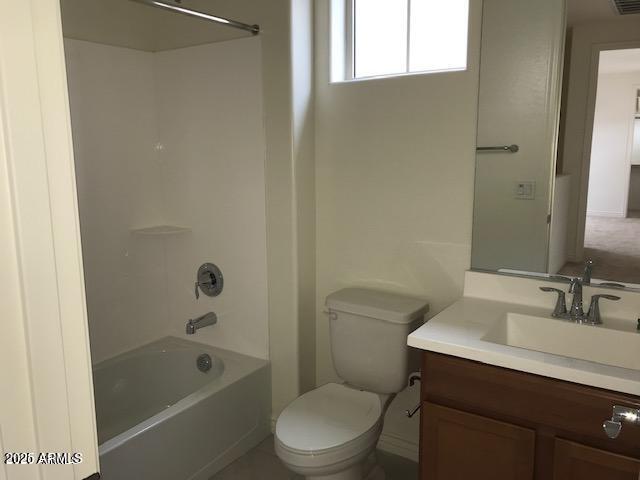 full bath with visible vents, toilet, vanity, and bathing tub / shower combination