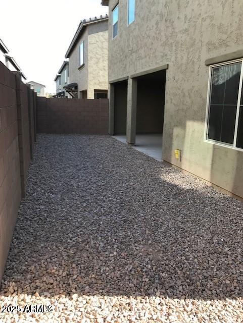 view of yard featuring a patio area and a fenced backyard