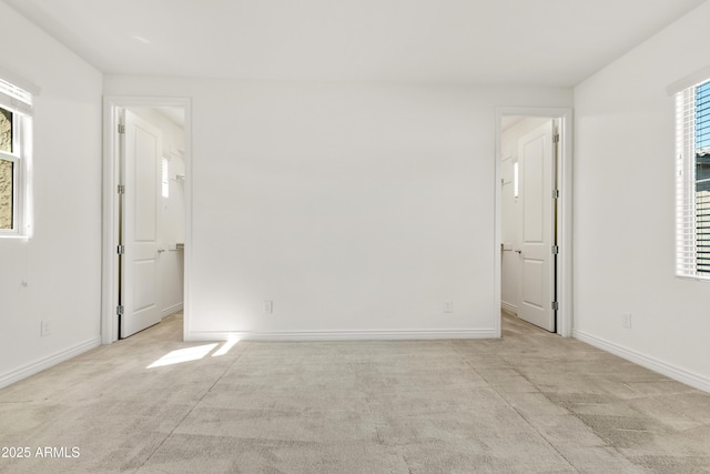 interior space featuring multiple windows and baseboards