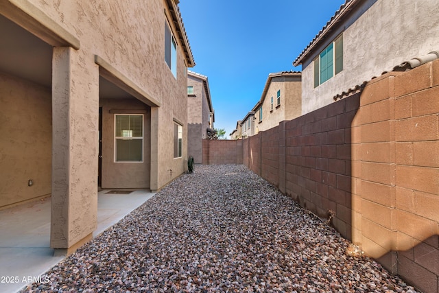 view of yard with a patio and a fenced backyard