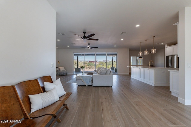 3909 S Veronica Ln, Gold Canyon, AZ 85118 - living room featuring light wood-style flooring, ceiling fan, visible vents, and recessed lighting
