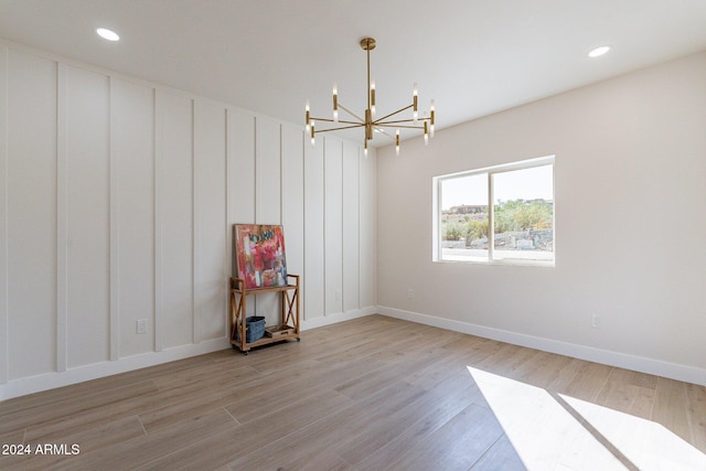 3909 S Veronica Ln, Gold Canyon, AZ 85118 - unfurnished room featuring wood finished floors, a notable chandelier, baseboards, and recessed lighting