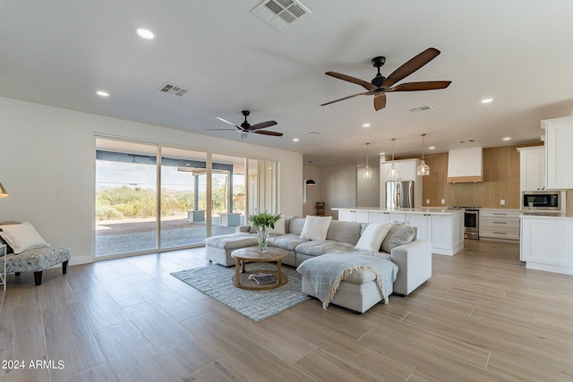 3909 S Veronica Ln, Gold Canyon, AZ 85118 - living room featuring light wood-style flooring, ceiling fan, visible vents, and recessed lighting