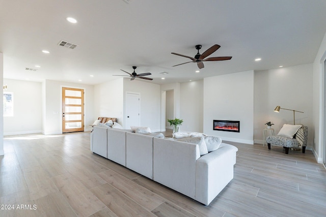 3909 S Veronica Ln, Gold Canyon, AZ 85118 - living area featuring ceiling fan, a glass covered fireplace, visible vents, recessed lighting, and light wood finished floors