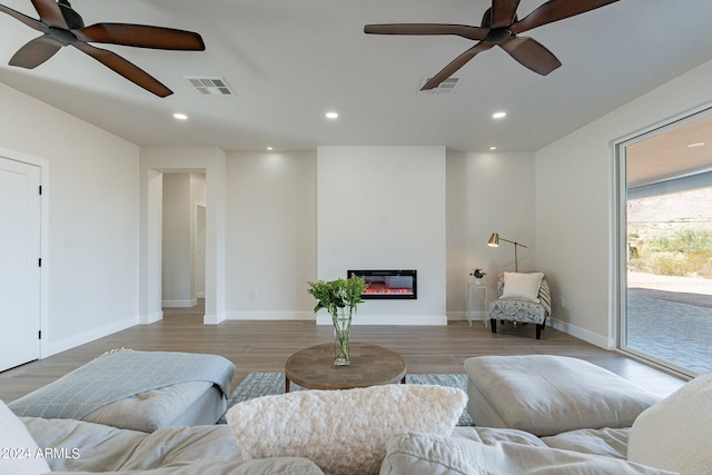 3909 S Veronica Ln, Gold Canyon, AZ 85118 - living room featuring visible vents, light wood-style flooring, and ceiling fan