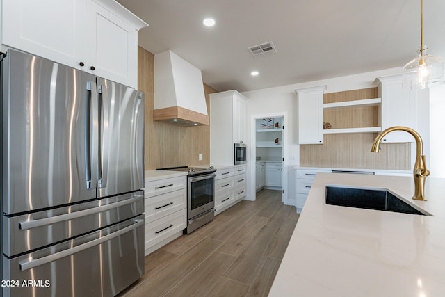 3909 S Veronica Ln, Gold Canyon, AZ 85118 - kitchen featuring custom exhaust hood, open shelves, visible vents, appliances with stainless steel finishes, and a sink